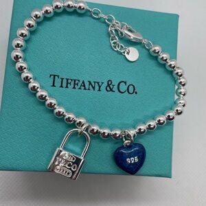 Tiffany & Co. Silver Bracelet with Blue Heart and Lock Charms